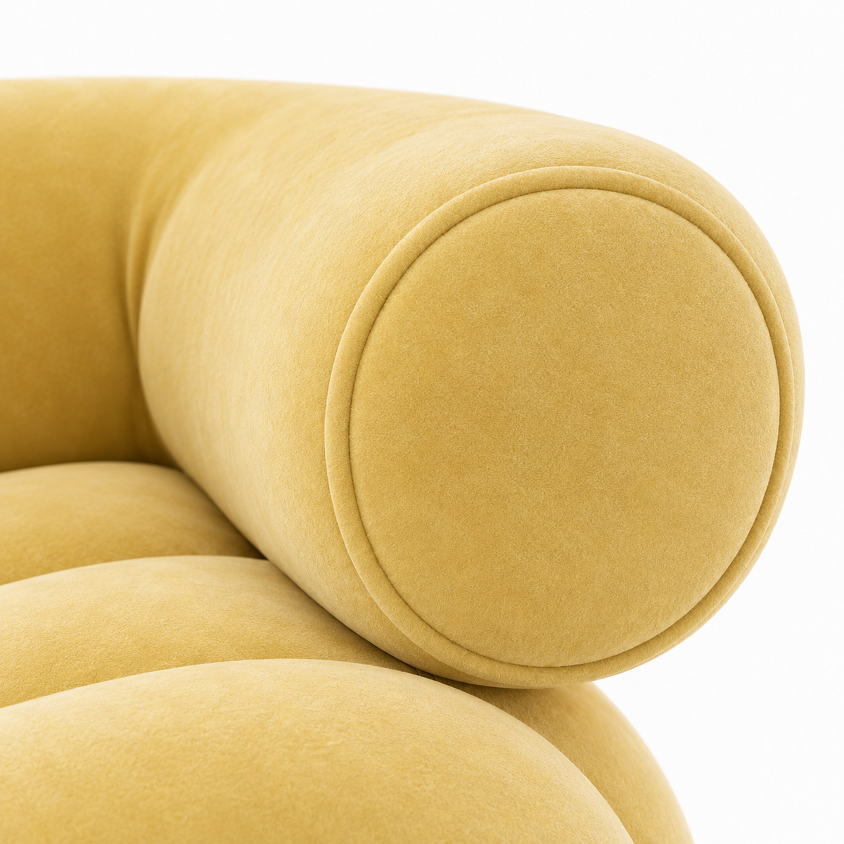 Close-up of Cira armchair round bolster arm end and butter yellow velvet texture