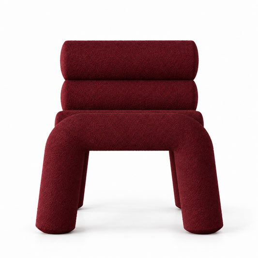 Juno Accent Chair front view showing arched tube legs and stacked back rollers in burgundy boucle