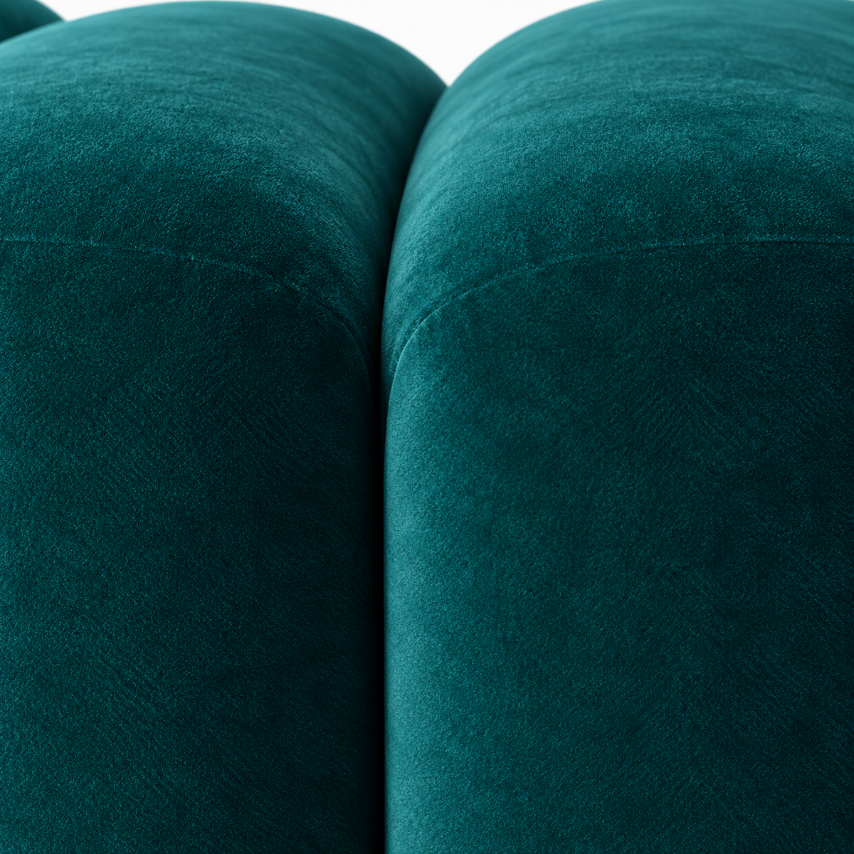 Close-up of deep teal velvet nap and the channel between two fluted segments on the Saja bench