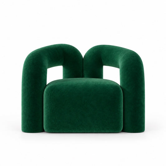 Nova armchair front view showing overlapping arch arms and plush seat in green velvet