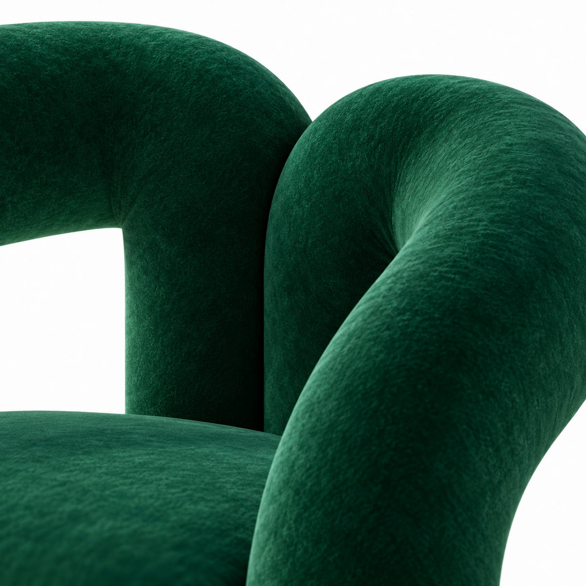 Close-up of Nova armchair green velvet where the two arms overlap behind the seat