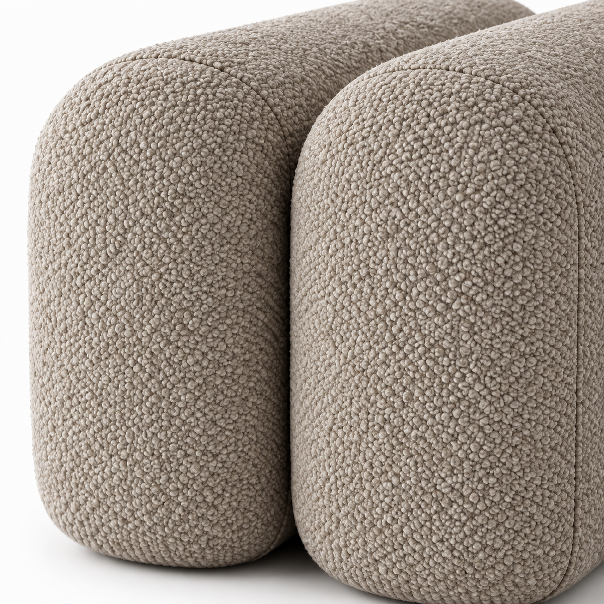 Close-up of mushroom taupe boucle texture and the channel between two rounded segments on the Onda bench