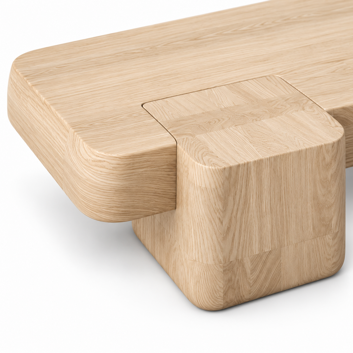Close-up of the pale ash wood grain at the rounded slab corner and cube block of the Kavo coffee table