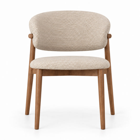 Vela dining chair front view showing curved backrest and rounded seat in beige linen