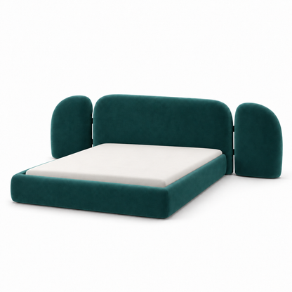 Vora bed frame in deep teal velvet with a three-part winged headboard and low platform, three-quarter view
