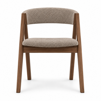 Rovo dining chair front view showing the inward-angling legs and curved back band in mushroom taupe boucle
