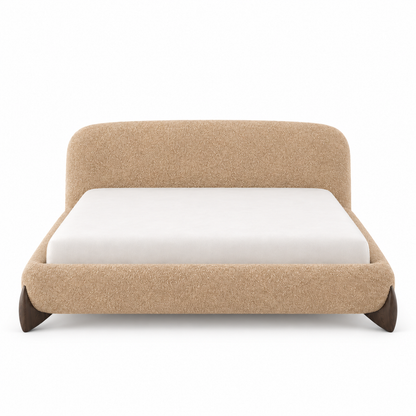 Caramel-oat boucle Orma bed frame front view showing the rounded headboard and thick rounded rail
