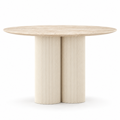 Vello dining table front view showing the round stone top and double fluted pedestal
