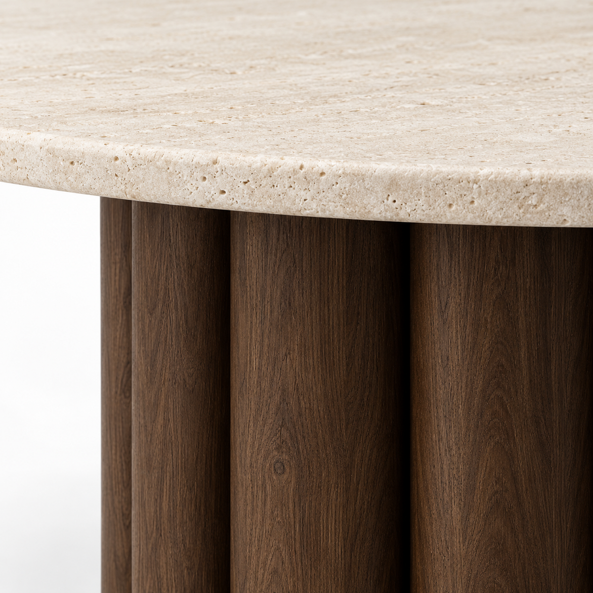 Close-up of the thick curved wooden staves of the Nolo dining table base meeting the travertine edge