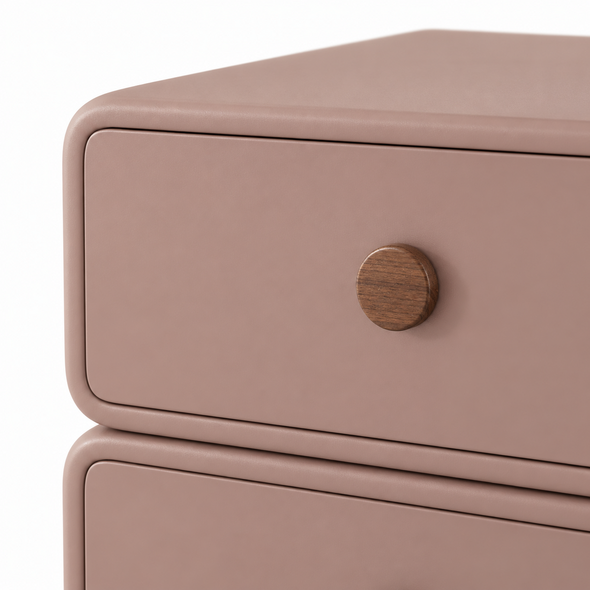 Close view of a round walnut knob and the rounded-corner edge on the rosewood Lumi nightstand
