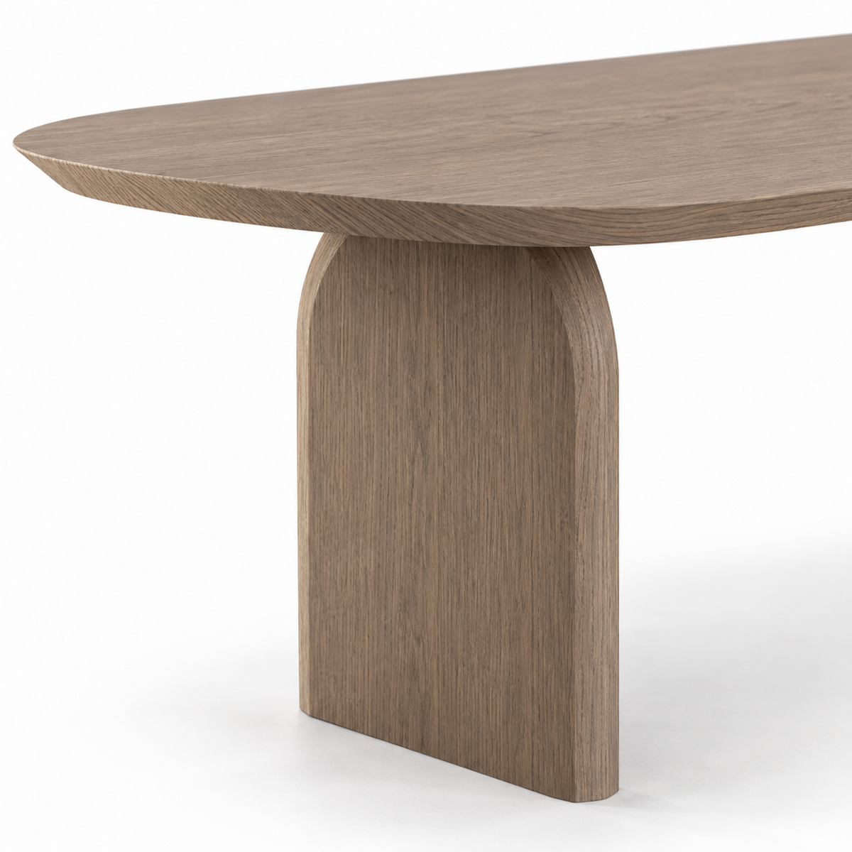 Close-up of smoked oak grain at the knife-edge top and the arched slab leg of the Ardo dining table