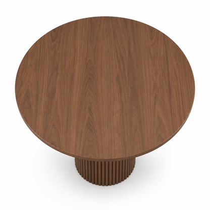 Orso dining table top showing the clean round shape in warm walnut