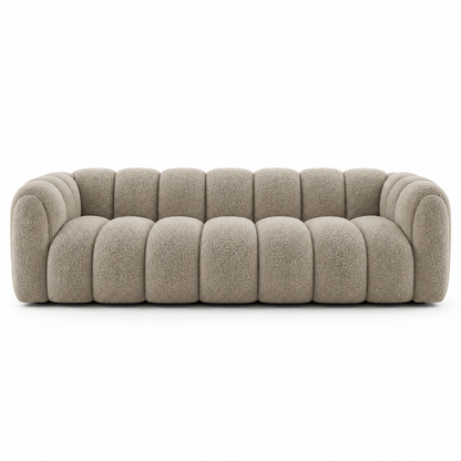 Front view of the mushroom taupe Sella sofa showing the deep channel tufting across seat and back
