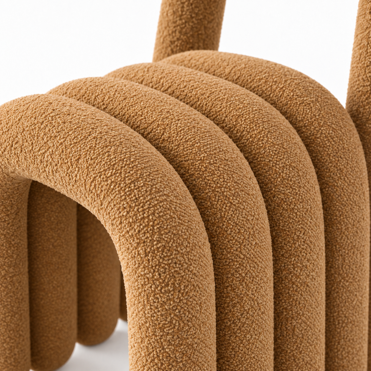 Close-up of Arca chair caramel boucle texture on the tube arches
