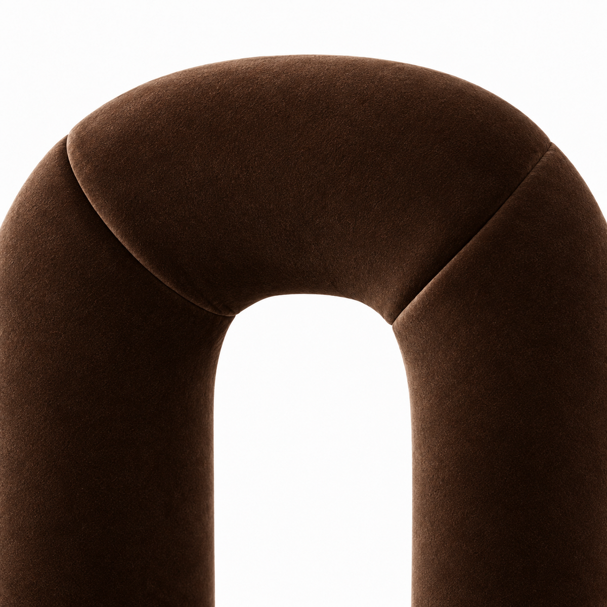 Close-up of Otto accent chair chocolate velvet showing soft sheen where the back arches over
