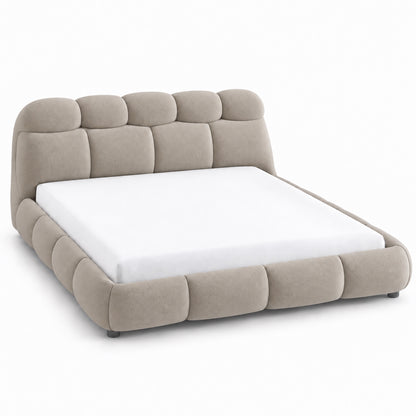 Ghaim Cloud Bed fully upholstered platform bed with padded headboard in warm ivory, three-quarter view