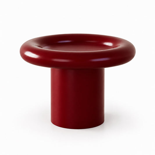 Halqa donut side table with rounded top and pedestal base in deep burgundy, angled view