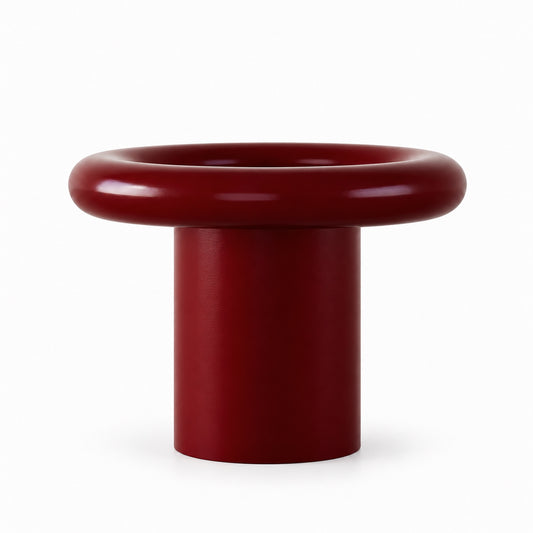 Halqa burgundy donut table front view, smooth sculptural finish