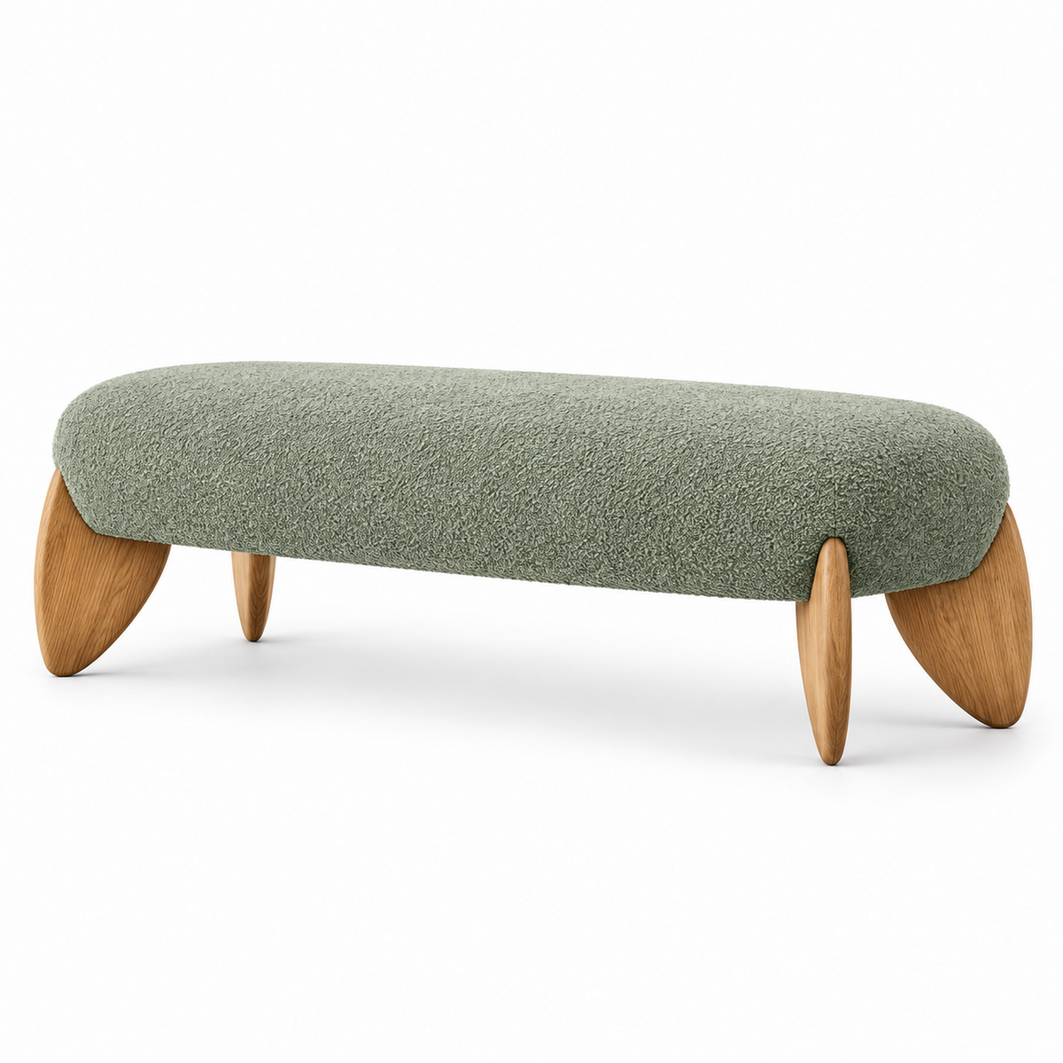 Vela bench in sage green boucle with warm oak leaf-shaped legs, three-quarter view
