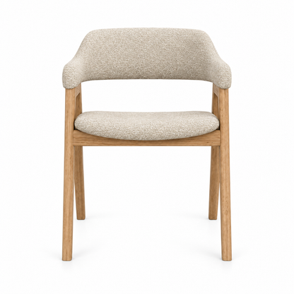 Anso dining chair front view showing the wrap-around back-and-arm band and oak frame in oat boucle
