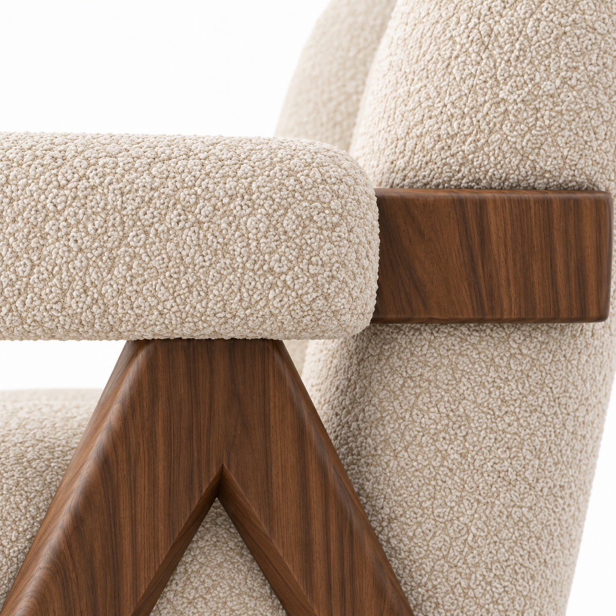 Close-up of Chandi armchair oatmeal boucle channels meeting the walnut arm bar
