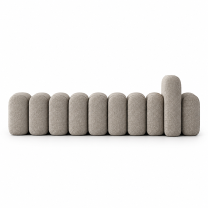 Onda bench front view showing the pillowed vertical segments and raised arm block in mushroom taupe boucle
