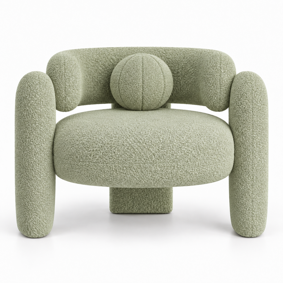 Pomo armchair front view showing round seat and centred ball toss pillow in pistachio boucle