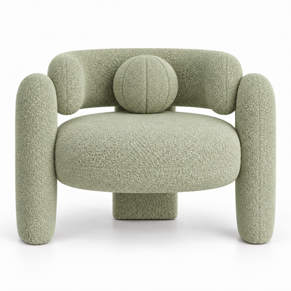 Pomo armchair front view showing round seat and centred ball toss pillow in pistachio boucle