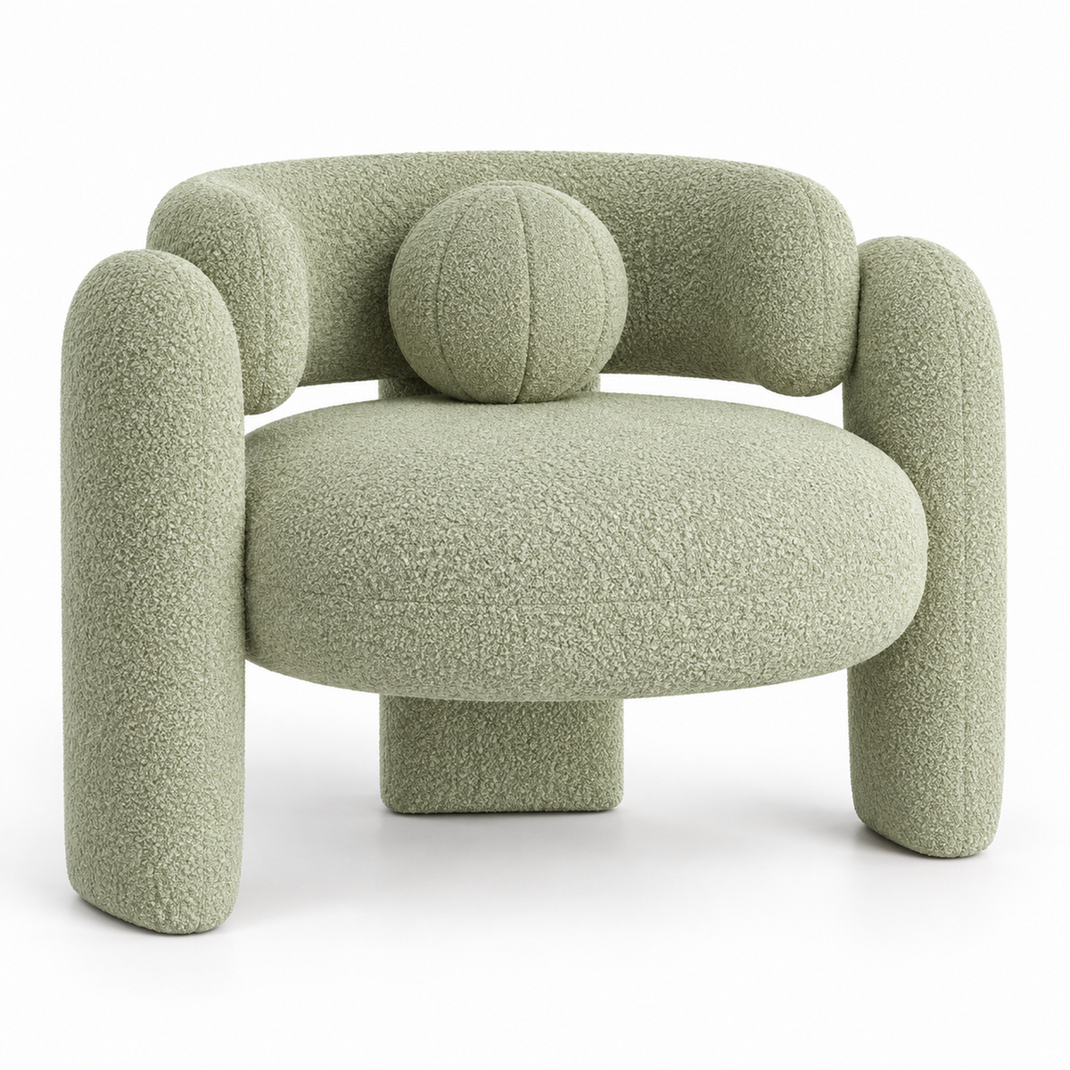 Pomo sculptural boucle armchair with round seat, crossing tube arms and round toss pillow in soft pistachio, three-quarter view