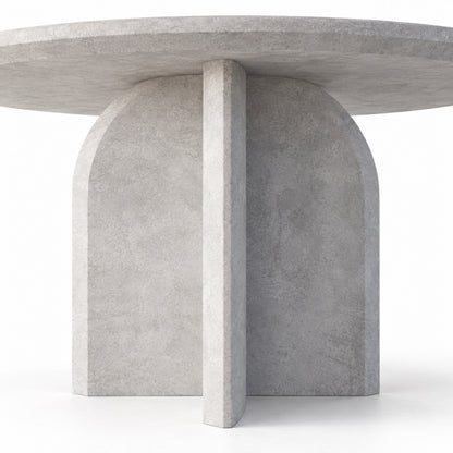 Close-up of Qamar dining table pedestal base where the arched slabs cross