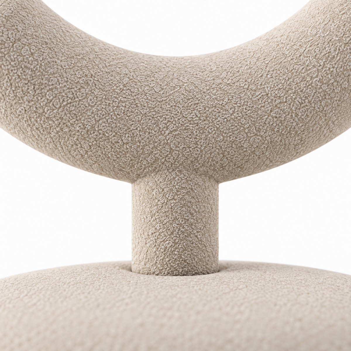 Close-up of Taso accent chair sand boucle texture where the backrest meets its stem
