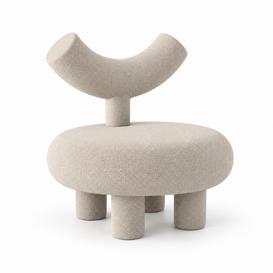 Taso sculptural accent chair with round drum seat and raised curved backrest in warm sand boucle, three-quarter view
