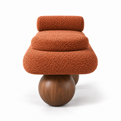 Kura bench side profile showing the rounded pebble seat and walnut ball foot
