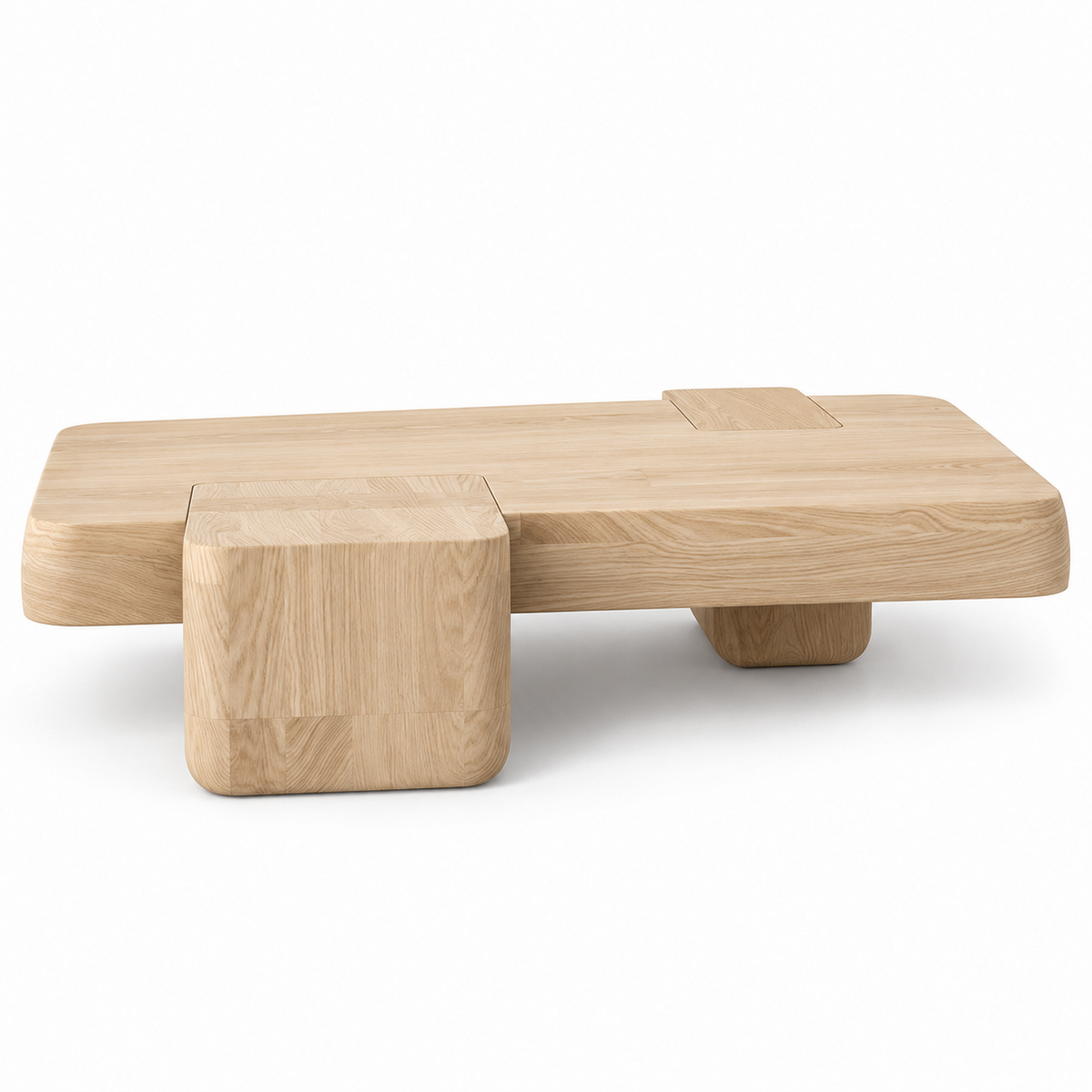 Kavo coffee table in pale natural ash with a stepped slab top and cube block, three-quarter view
