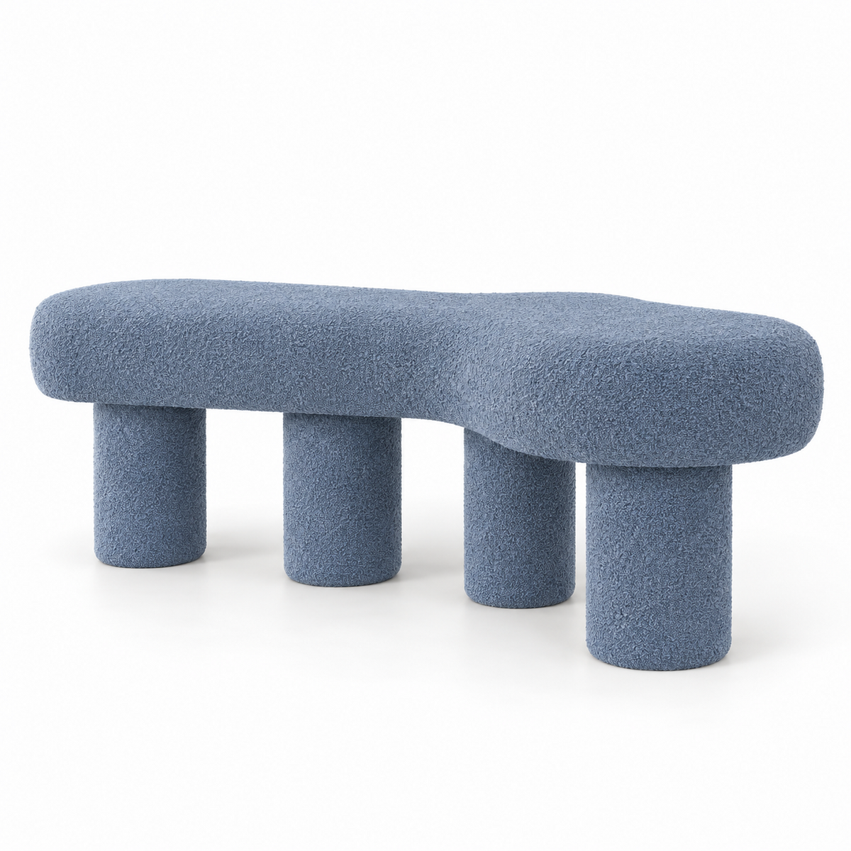 Oru bench in slate blue boucle with a cloud-shaped top on four pillar legs, three-quarter view