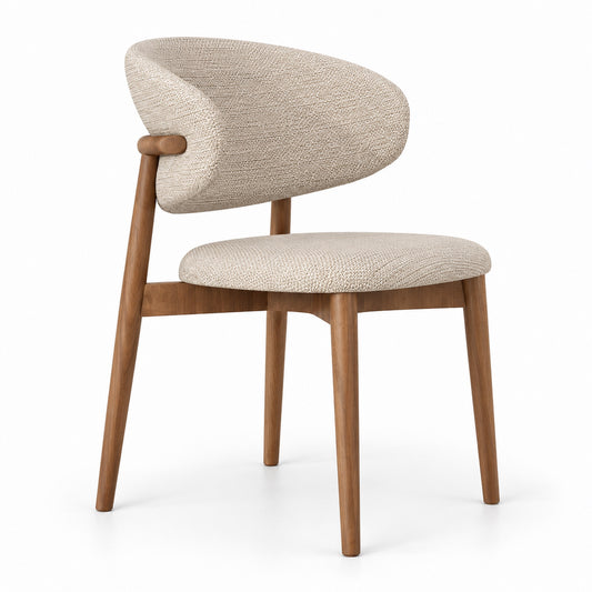 Vela dining chair with curved shell back in beige linen on a walnut wood frame, three-quarter view